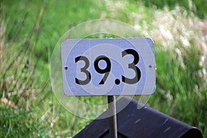 Distance sign at a railroad track in the Nehterlands in kilometres in Moordrecht..