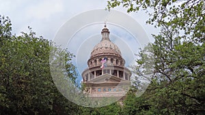The distance view of the Texas State Capitol Dome with visitors walking on the path on the area near Austin, Texas, U.S