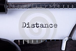 Distance on white sheet in vintage typewriter