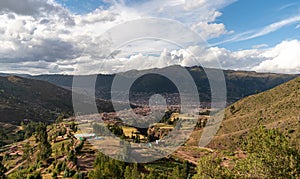 a distant city and mountains in the background