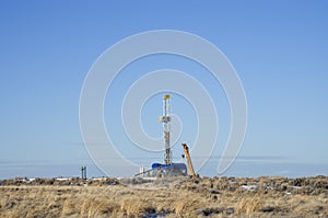 Distant drill rig photo