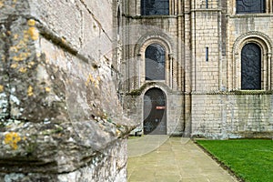 Distant focus of a wooden door, with entry to the cathedral crypt.