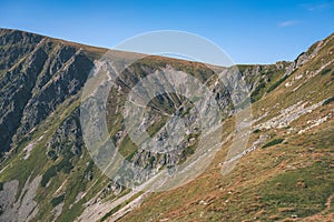 Distant mountain cores in slovakia Tatra mountain trails - vintage retro film look