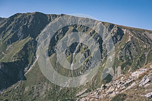 Distant mountain cores in slovakia Tatra mountain trails - vintage retro film look