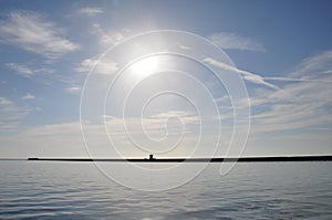 Distant pier blue sea and sky