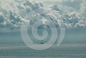 Distant sailboats on lake