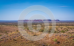 Distant scenic panorama of Gosse`s Bluff an eroded remnant of an impact crater in central outback Australia photo