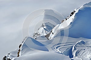 Distant snow covered peaks above clouds