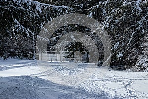 Distant tennis court covered completely in snow