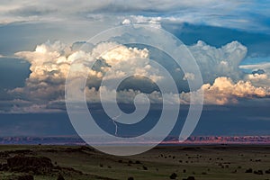 Distant thunderstorm with lightning approaching. photo