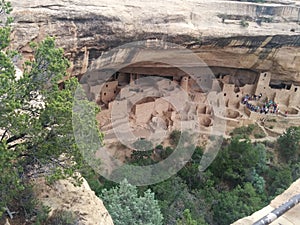 Distant tourist group at ancient ruins at Mesa Verde National Park