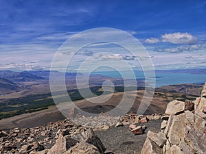 A blue lago and rocky landscape under a beautiful sky photo