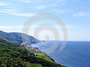 A distant view of the Cabot Trail on Cape Breton Island, Nova Scotia, Canada. The beautiful coastal highway provides amazing view