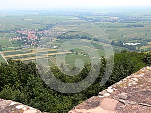 Distant view of the castle in the valley with a small village