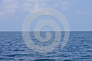 Distant view of a desert island in the Indian ocean Ari Atoll, Maldives