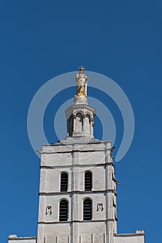 Distant view of the gilded statue overlooking Avignon cathedral in France