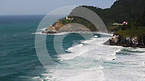 A distant view of the Heceta Head lighthouse.