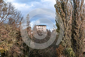 Distant view in Weimar with building, bordered with trees from a park