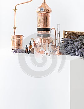 Distillation of lavender essential oil. Copper alambic in a Scandinavian interior. Chemical laboratory