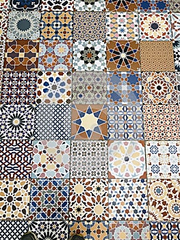 Distinctive and colorful patterns of floor tiles of stores in Thailand.