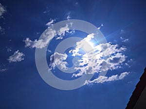 A distinctive view of blue sky with some white clusters of white clouds