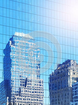 Distorted view of buildings reflected in windows of a modern skyscraper, abstract urban background, color toning applied, New York