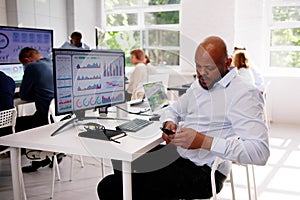 Distracted Businessman Using Mobile Phone