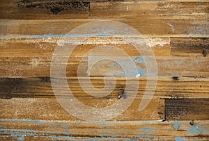 Distressed barn wood background with touches of blue and brown and white paint