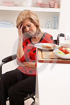 Distressed Disabled Senior Woman Making Sandwich