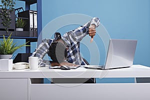 Distressed and exhaused hard working company employee falling asleep on desk