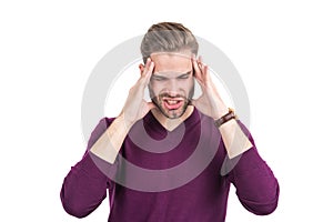 Distressed guy with closed eyes squeeze head with hands suffering from headache, migraine
