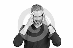 Distressed guy with closed eyes squeeze head with hands suffering from headache, migraine