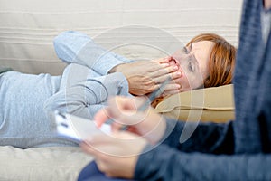 Distressed lady talking to woman with clipboard