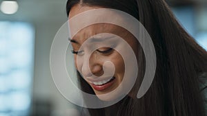 Distressed office woman crying sitting sofa closeup. Professional feeling sad