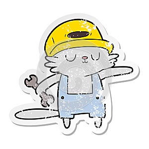 distressed sticker of a cartoon cat builder