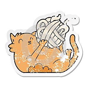 distressed sticker of a cartoon cat playing with ball of string