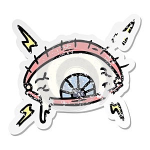 distressed sticker cartoon doodle of an enraged eye