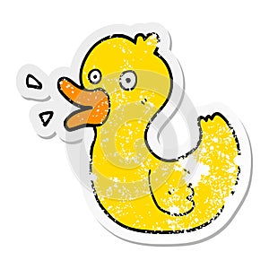 distressed sticker of a cartoon quacking duck