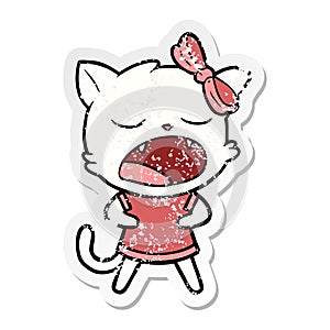 distressed sticker of a cartoon yawning cat