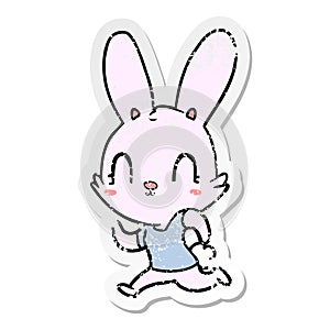 distressed sticker of a cute cartoon rabbit running