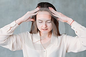 Distressedssed woman head massage gentle pressure