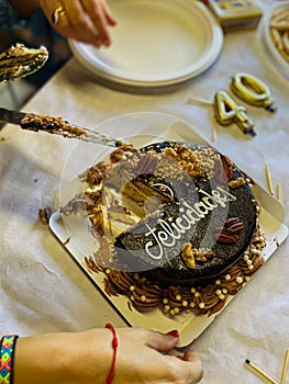 Distributing the birthday cake in a birthday celebration