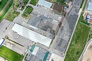 Distribution center and freight terminal with trucks. aerial overhead view