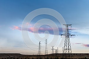 Distribution of electric towers at dusk