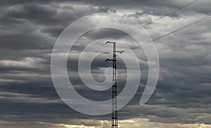 Rural power grid pylon with a cloudy storm sky. photo