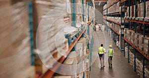 Distribution, logistics and supply chain with warehouse team walking together to check stock or storage. Delivery