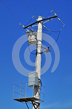 Distribution transformer on concrete power pole