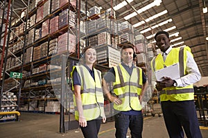 Distribution warehouse manager and colleagues look to camera