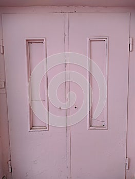 disturbing old and pink wooden door close up photo