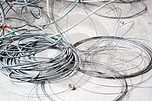 Disused discarded ruined abandoned LAN cable wires roll circle rope on the floor renovation decoration refurbish garbage trash